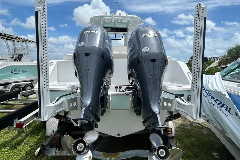 Slide: The Image of 2020 Sea Hunt Ultra 275 SE with dual Yamaha 200 engines, rear view. - 5