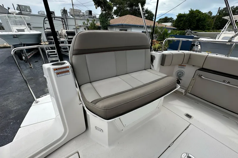 Slide: The Image of 2020 Cutwater C-28 boat interior with gray seating and stainless steel railings. - 17