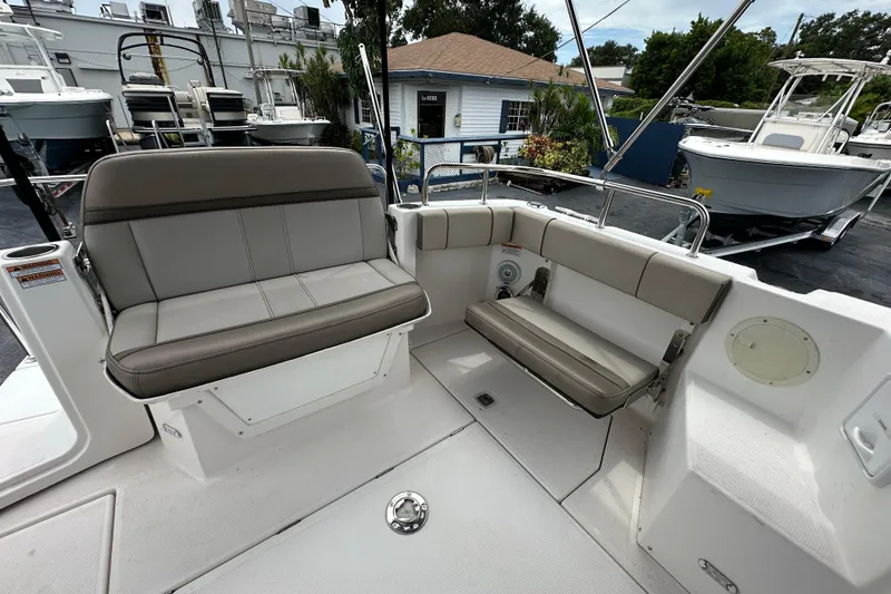 Slide: The Image of 2020 Cutwater C-28 boat interior with cushioned seating and sleek design. - 18