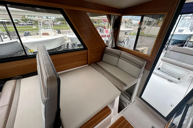 Slide: The Image of Interior of 2020 Cutwater C-28 boat with seating and large windows. - 26