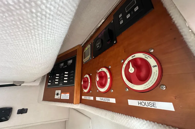 Slide: The Image of Control panel of a 2020 Cutwater C-28 boat with labeled switches and dials. - 35