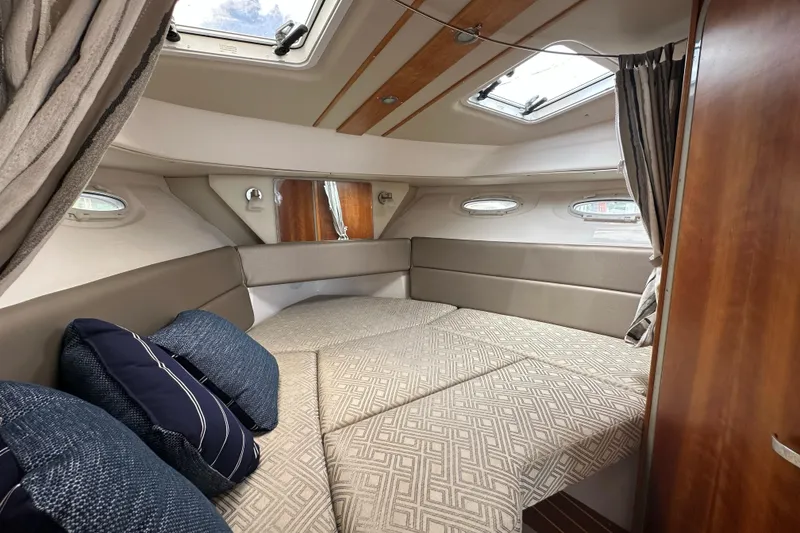 Slide: The Image of 2020 Cutwater C-28 cabin interior with cozy bedding and stylish decor. - 39