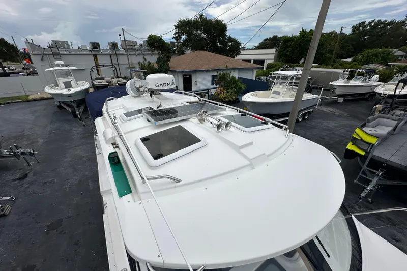 Slide: The Image of 2020 Cutwater C-28 boat with Garmin equipment, parked among other boats. - 47