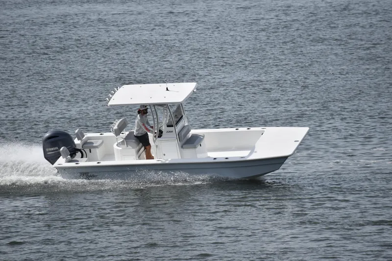 The Image of 2025 KenCraft 2260 Bay Rider Skiff cruising on water. - 0