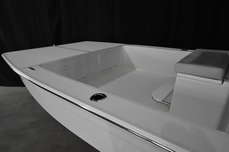 Slide: The Image of 2025 KenCraft 2260 Bay Rider Skiff interior view with seating and storage compartments. - 11