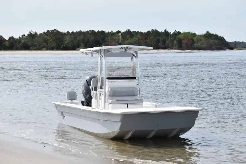 Slide: The Image of 2025 KenCraft 2260 Bay Rider Skiff on a sandy shore. - 6