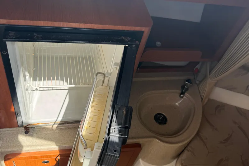 Slide: The Image of 2005 Hydra-Sports Vector 2500 VX interior with open fridge and compact sink area. - 6