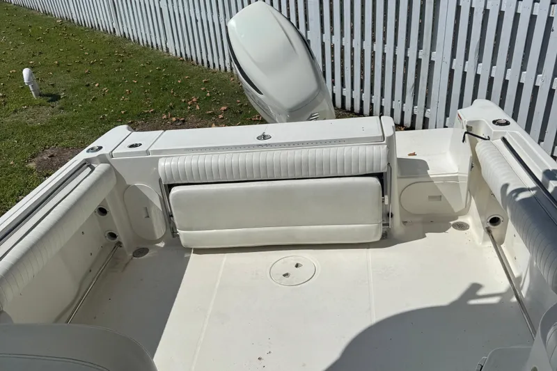 Slide: The Image of 2005 Hydra-Sports Vector 2500 VX boat interior with white seating and outboard motor. - 9