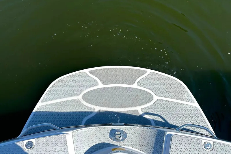 Slide: The Image of 2008 Air Nautique Crossover 236 swim platform on calm water. - 29