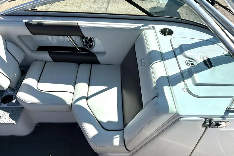 Slide: The Image of 2008 Air Nautique Crossover 236 boat interior with white seating and cup holders. - 34