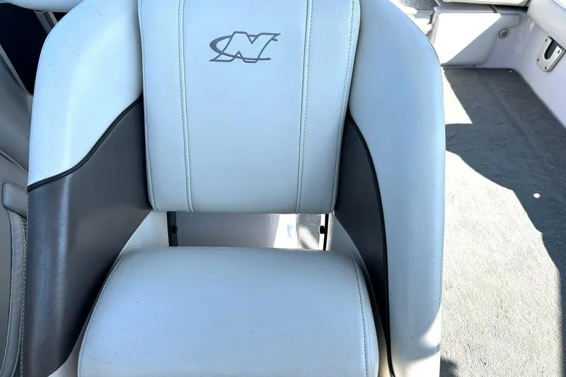 Slide: The Image of 2008 Air Nautique Crossover 236 boat seat with logo, white and gray upholstery. - 39