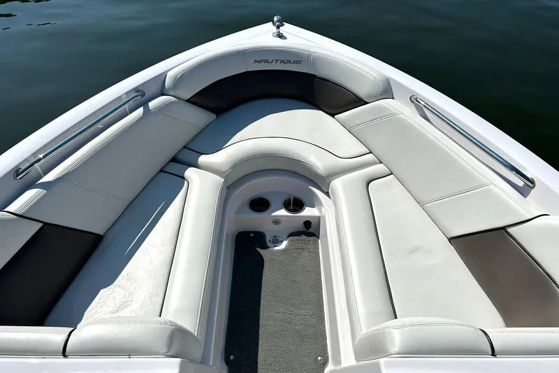 Slide: The Image of 2008 Air Nautique Crossover 236 boat interior with white cushioned seating. - 41