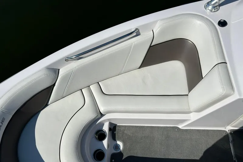 Slide: The Image of 2008 Air Nautique Crossover 236 boat interior seating with white upholstery. - 43