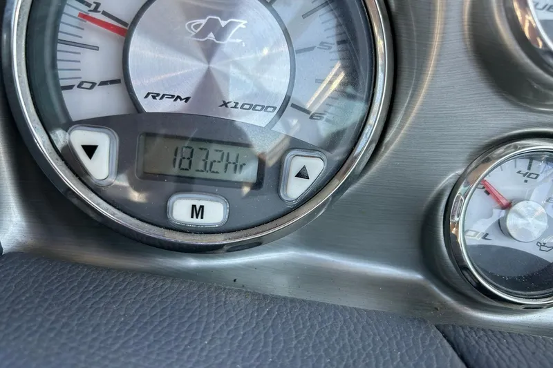 Slide: The Image of Close-up of 2008 Air Nautique Crossover 236 dashboard showing 183.2 hours on RPM gauge. - 45