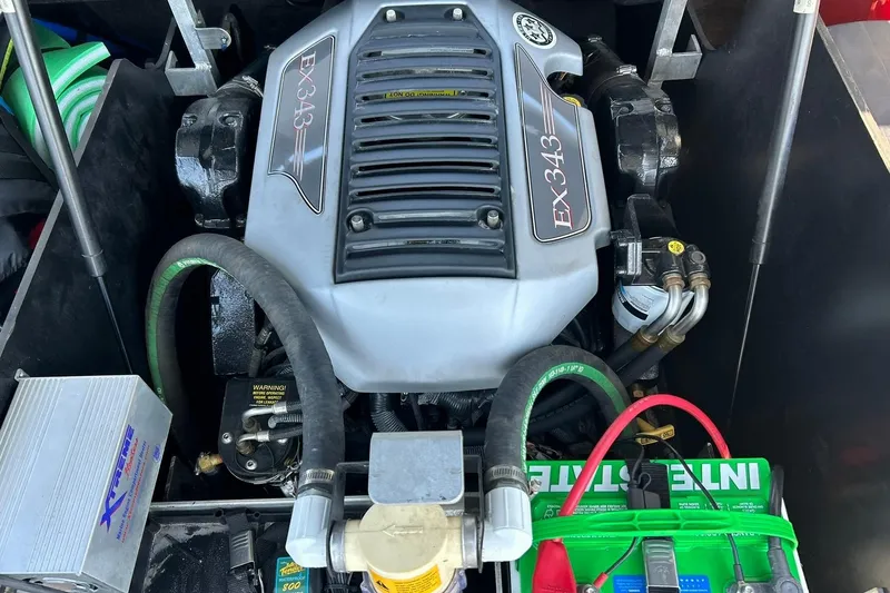 Slide: The Image of 2008 Air Nautique Crossover 236 engine compartment with EX343 engine and battery. - 46