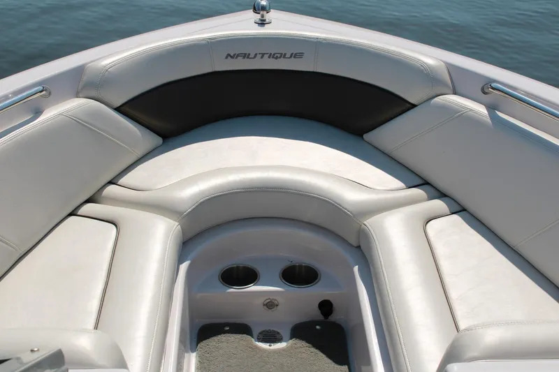 Slide: The Image of 2008 Air Nautique Crossover 236 boat interior with cushioned seating and cup holders. - 5