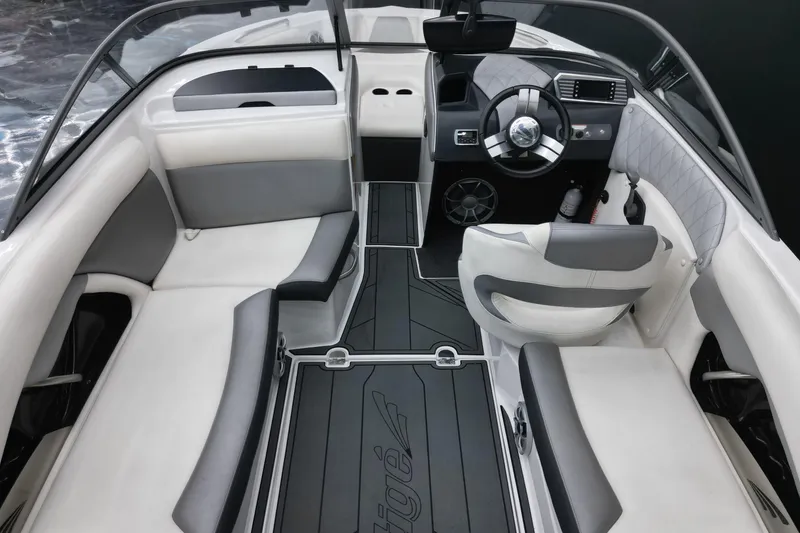 Slide: The Image of 2016 Tigé R20 boat interior with sleek seating and modern dashboard design. - 11