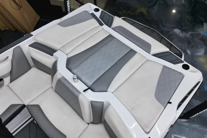 Slide: The Image of 2016 Tigé R20 boat interior with gray and white cushioned seating. - 14