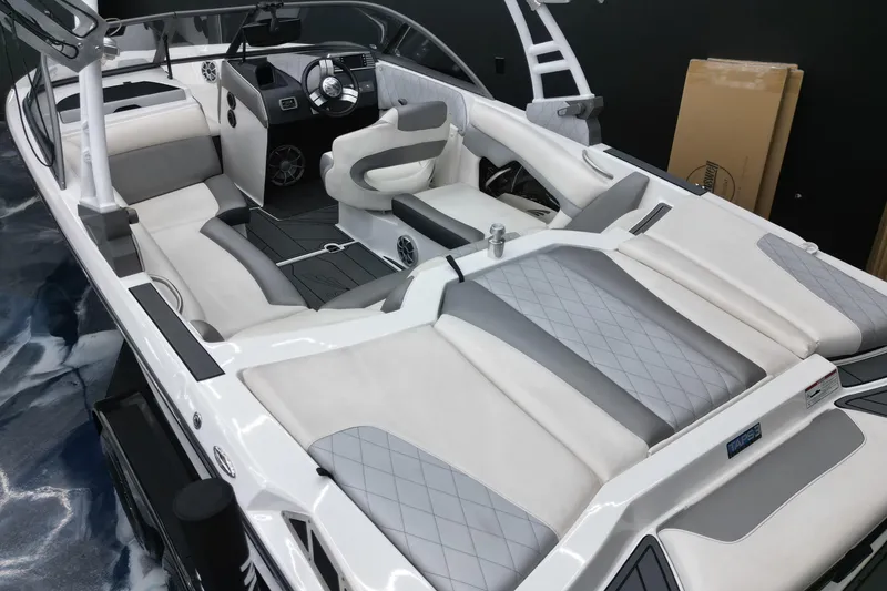 Slide: The Image of 2016 Tigé R20 boat interior with sleek white and gray seating design. - 9
