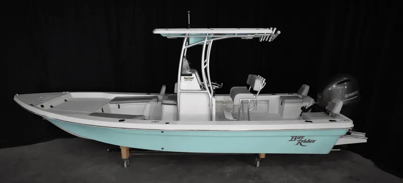 Slide: The Image of 2025 KenCraft 239 Bay Rider Bay boat with T-top and outboard motor. - 9