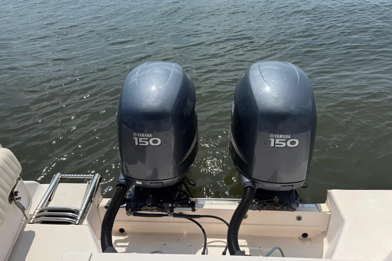 Slide: The Image of 2008 Grady-White Tournament 275 boat docked, featuring Yamaha outboard, under blue sky. - 10