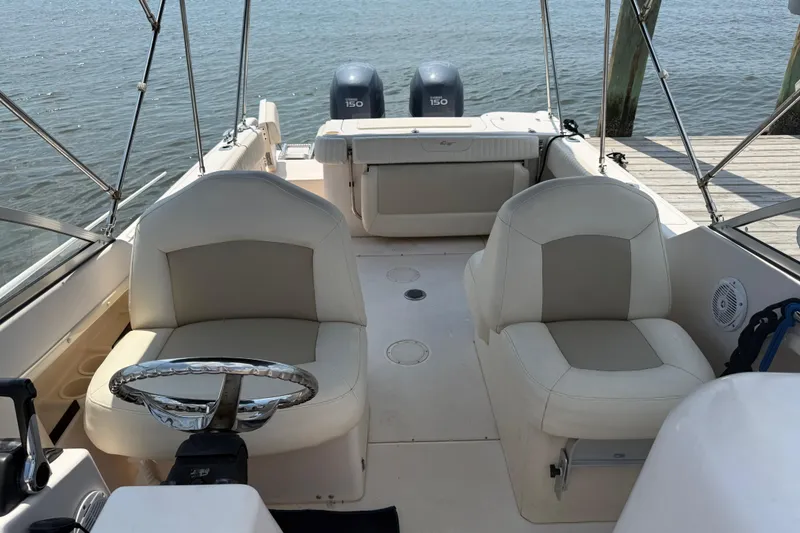 Slide: The Image of Bow of 2008 Grady-White Tournament 275 boat with anchor chain and storage compartments. - 13