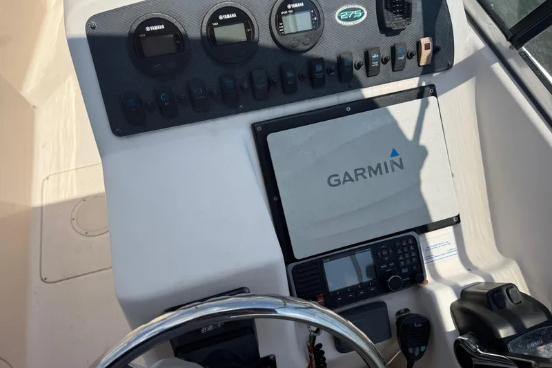 Slide: The Image of 2008 Grady-White Tournament 275 boat interior with dual consoles and seating. - 14