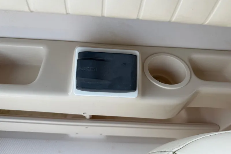 Slide: The Image of 2008 Grady-White Tournament 275 boat interior with cushioned seating and speaker. - 16