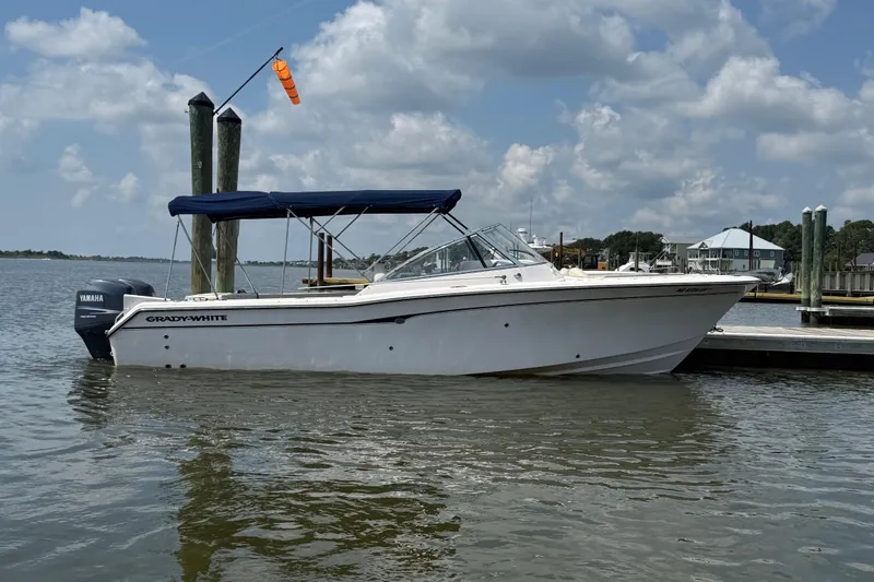 Slide: The Image of 2008 Grady-White Tournament 275 boat on trailer under clear sky. - 2