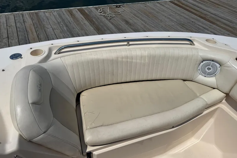 Slide: The Image of 2008 Grady-White Tournament 275 boat interior with cushioned seating and cup holders. - 20