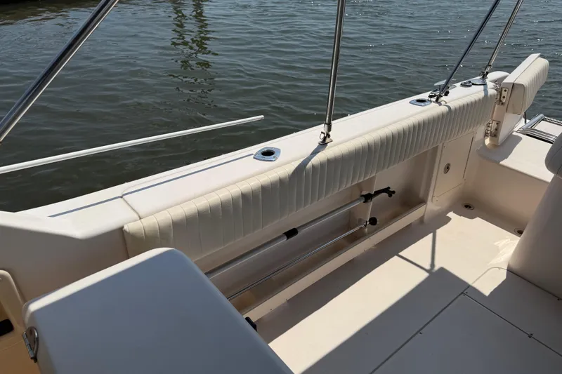 Slide: The Image of Open storage compartment with faucet on 2008 Grady-White Tournament 275 boat. - 21