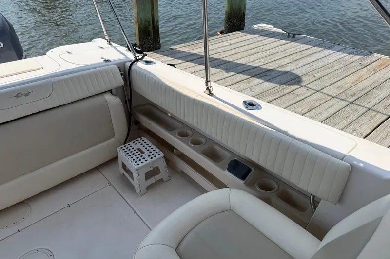 Slide: The Image of 2008 Grady-White Tournament 275 boat cockpit with steering wheel and control panel. - 22