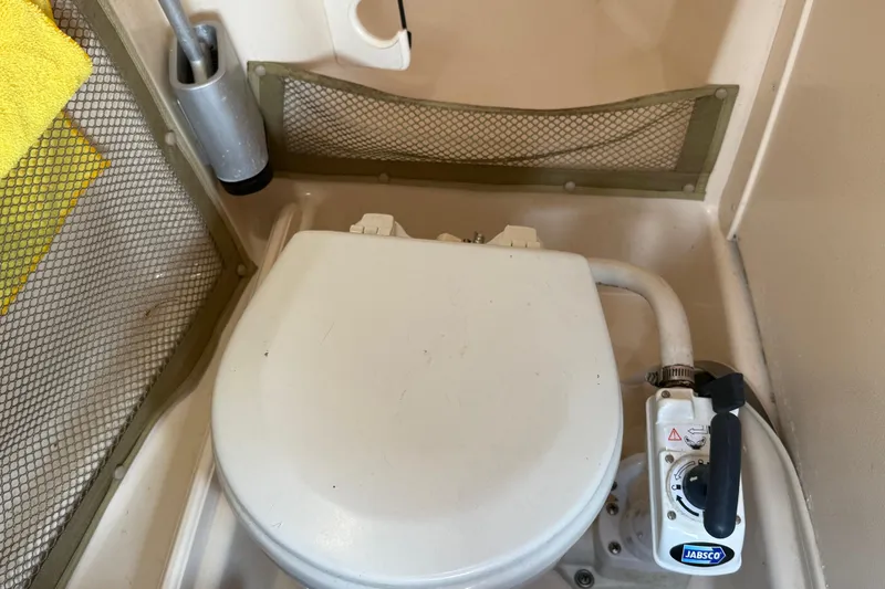 Slide: The Image of Control panel of a 2008 Grady-White Tournament 275 boat with radio and audio system. - 24