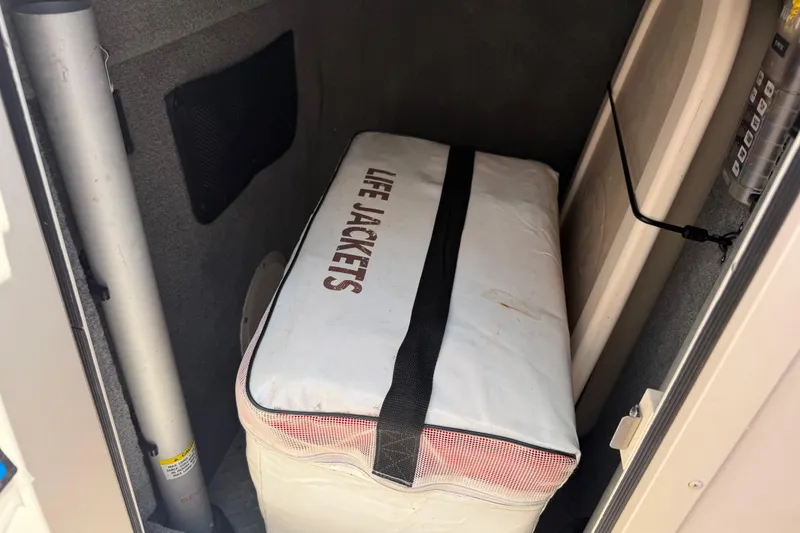 Slide: The Image of 2008 Grady-White Tournament 275 boat interior with cushioned seating and cup holders. - 26