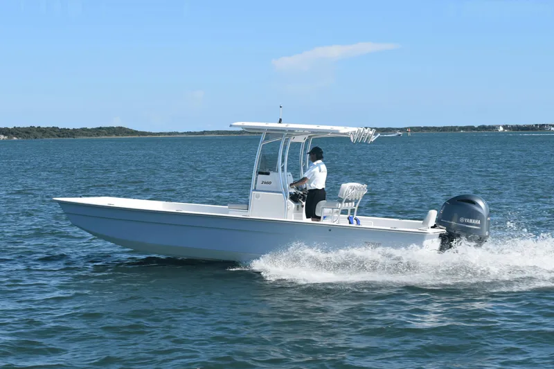 The Image of 2025 KenCraft 2460 Bay Rider Skiff cruising on open water. - 0