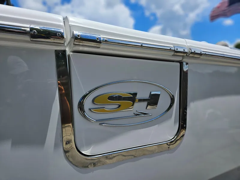 Slide: The Image of 2025 Sea Hunt Ultra 255 SE logo on a sleek white boat exterior. - 45