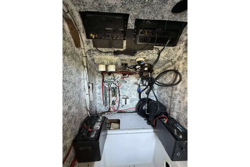 Slide: The Image of Electrical system inside a 1996 Silverhawk 24 boat, featuring wiring and components. - 12