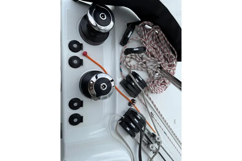Slide: The Image of Sailing equipment on 2023 Lagoon 46 catamaran, featuring winches and ropes. - 16