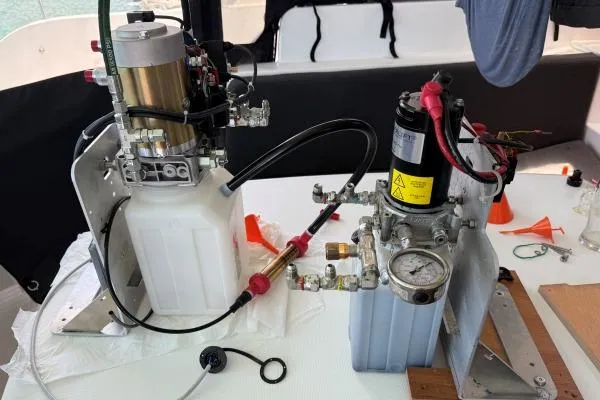 Slide: The Image of Hydraulic system components on a 2023 Lagoon 46 yacht, featuring pumps and gauges. - 25