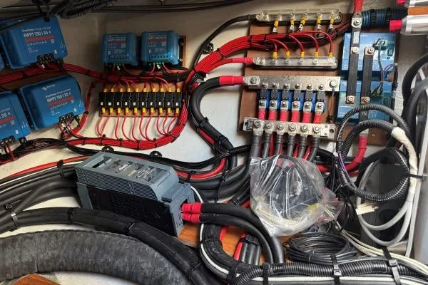 Slide: The Image of Electrical system of a 2023 Lagoon 46 yacht, featuring wiring and components. - 30