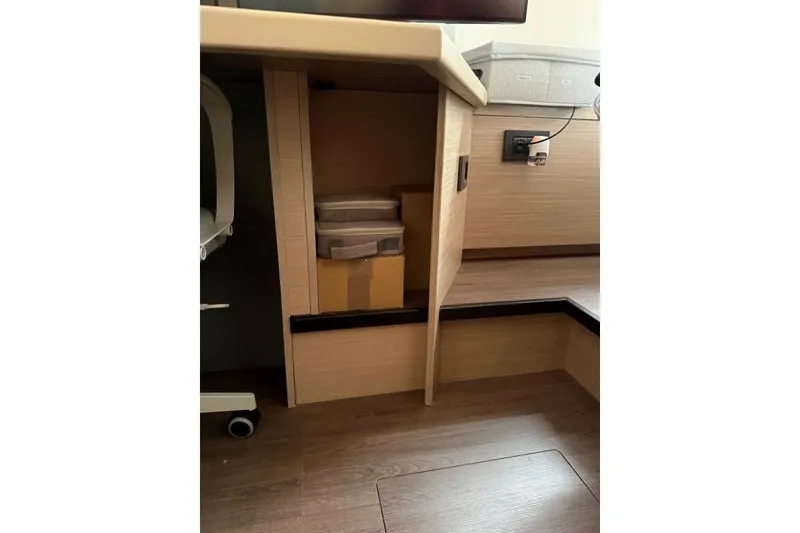 Slide: The Image of Interior storage space in 2023 Lagoon 46 yacht, featuring wooden cabinetry and modern design. - 5