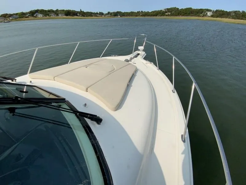 Slide: The Image of Tiara Yachts 36, 2013 model, cruising on calm waters with scenic shoreline. - 29