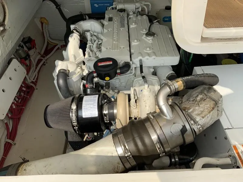 Slide: The Image of Engine compartment of a 2013 Tiara Yachts 36, showcasing detailed mechanical components. - 34