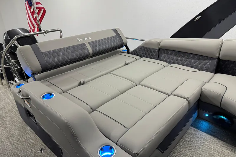 Slide: The Image of 2023 Barletta LUSSO 25U boat interior with luxurious gray seating and cup holders. - 10