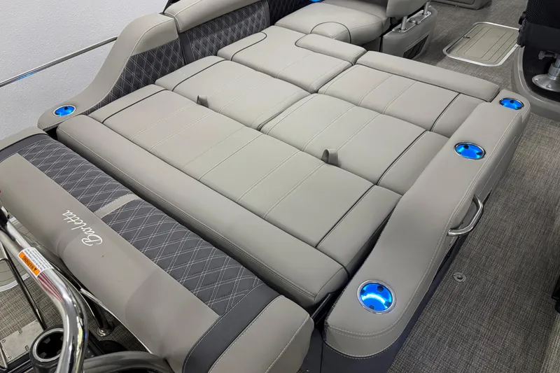 Slide: The Image of 2023 Barletta LUSSO 25U boat interior with luxurious seating and illuminated cup holders. - 11