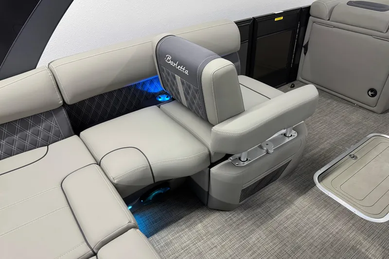 Slide: The Image of 2023 Barletta LUSSO 25U boat interior with luxurious seating and ambient lighting. - 13