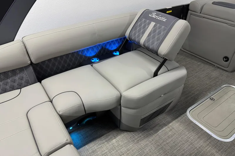 Slide: The Image of Luxurious seating in 2023 Barletta LUSSO 25U pontoon boat with ambient blue lighting. - 15