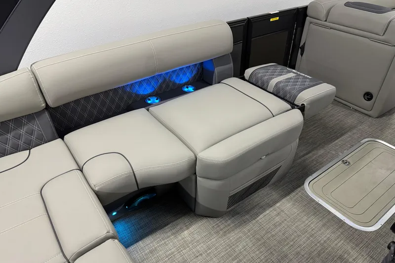 Slide: The Image of Luxurious interior of 2023 Barletta LUSSO 25U with plush seating and ambient lighting. - 16