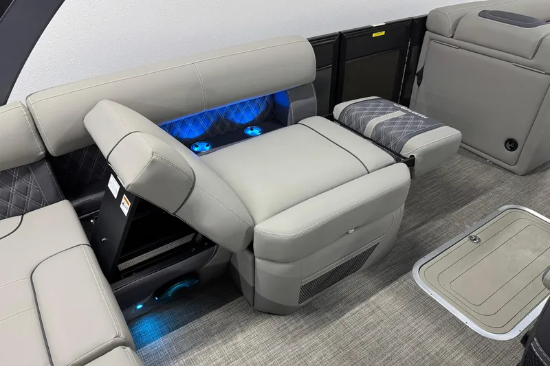 Slide: The Image of 2023 Barletta LUSSO 25U interior with luxurious seating and ambient blue lighting. - 17