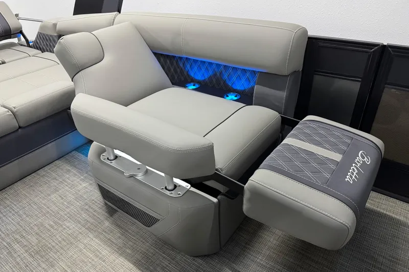 Slide: The Image of Luxurious 2023 Barletta LUSSO 25U boat seating with elegant design and ambient blue lighting. - 19